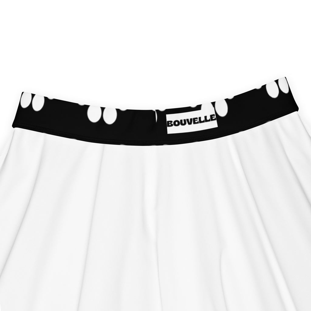 White pleated skater skirt with black paw print waistband made from recycled fabric by bouvelle with upf 50+ protection