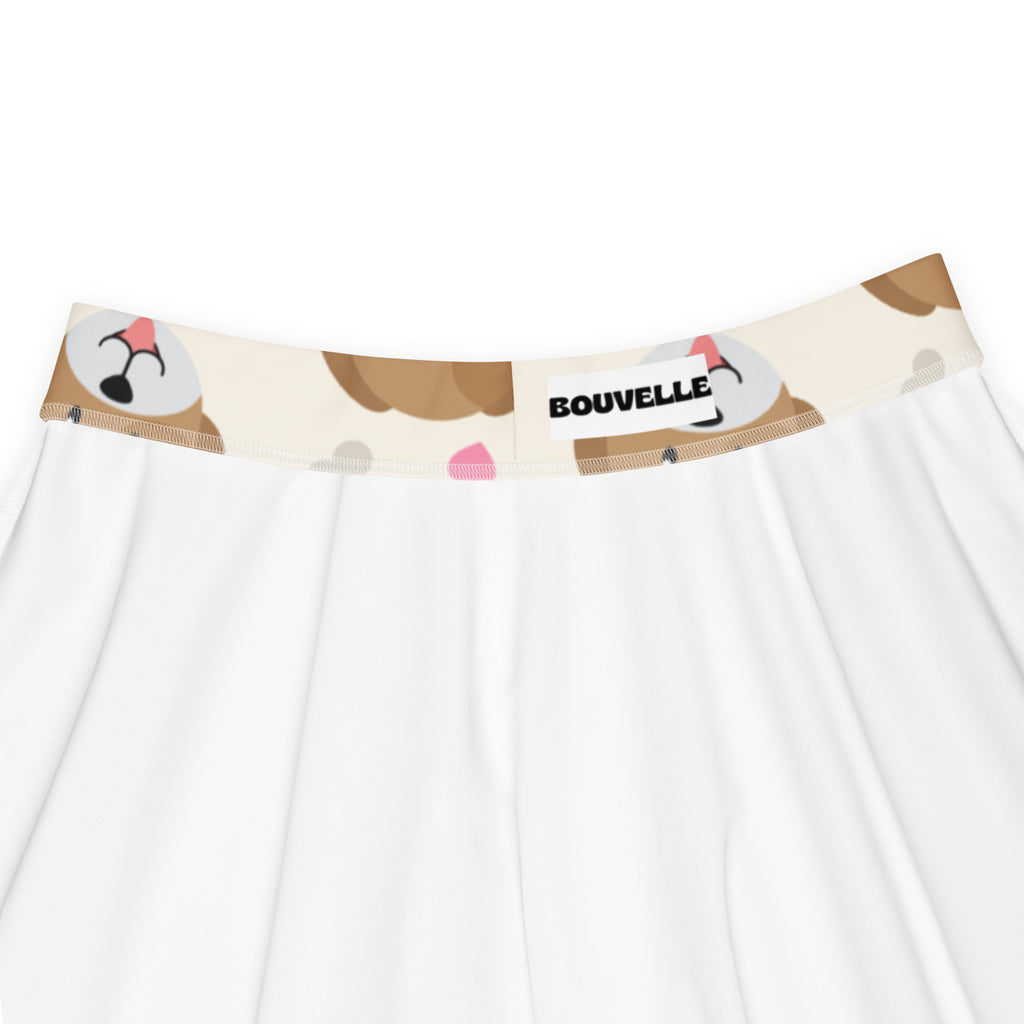 White skirt with beige waistband featuring brown and pink cartoon dog faces flowy high waisted with upf 50 plus recycled fabric
