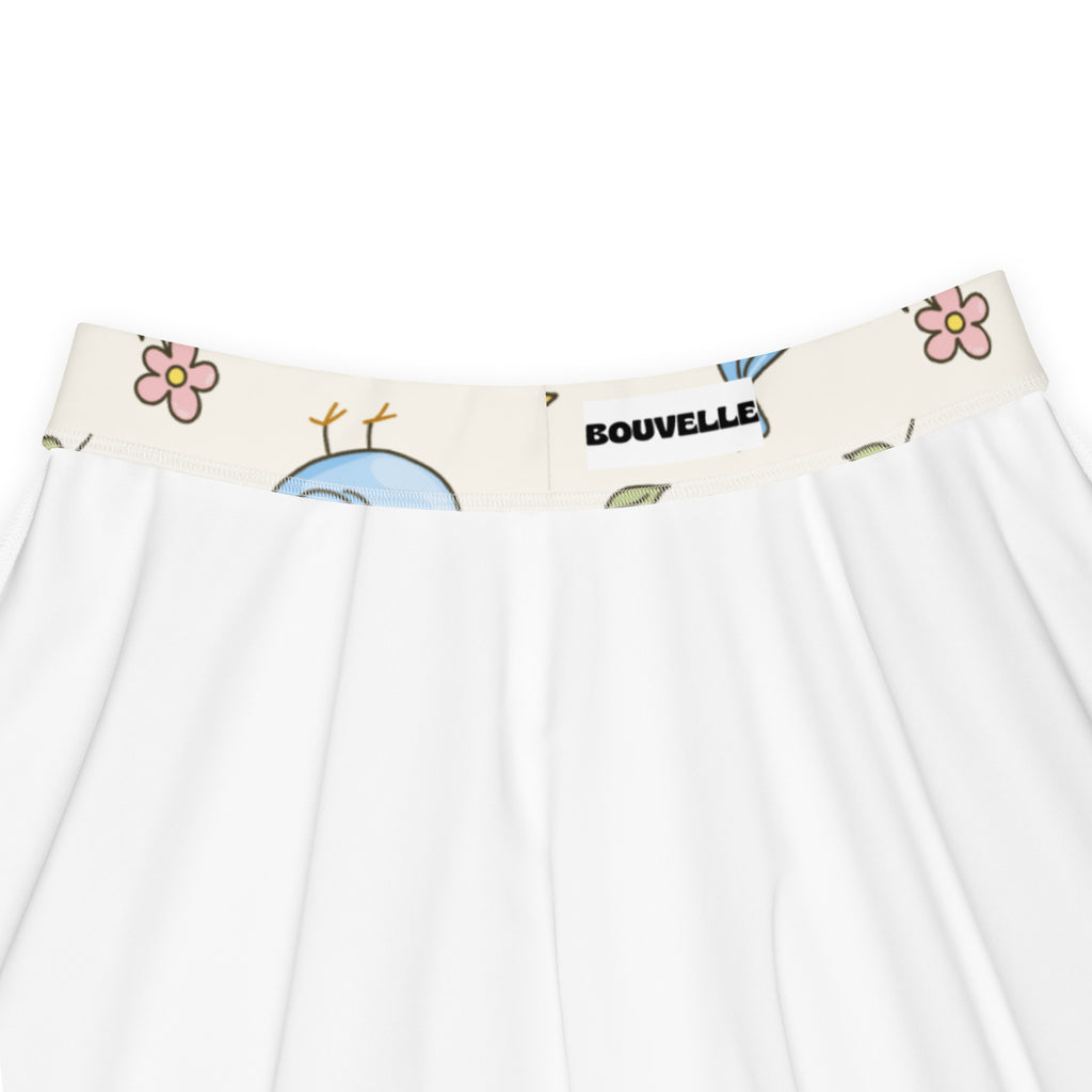 Women’s blue bird skater skirt with cream elastic waistband printed with pink flowers blue insects and bouvelle logo