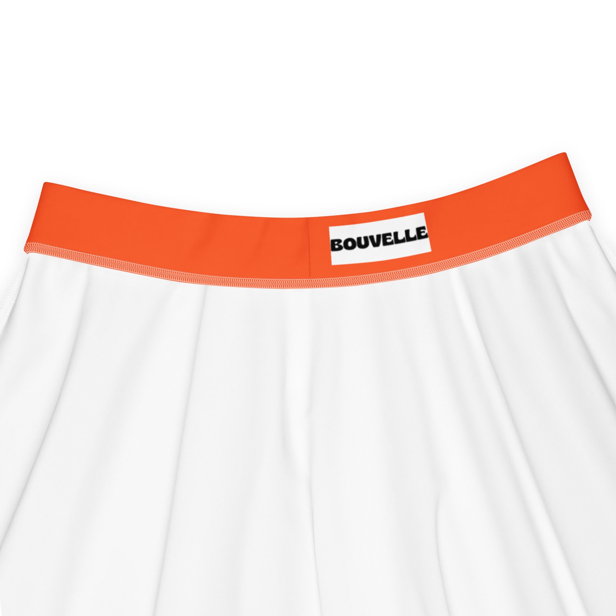 White underwear with bright orange elastic waistband featuring bouvelle brand label paired with a bright orange skater skirt