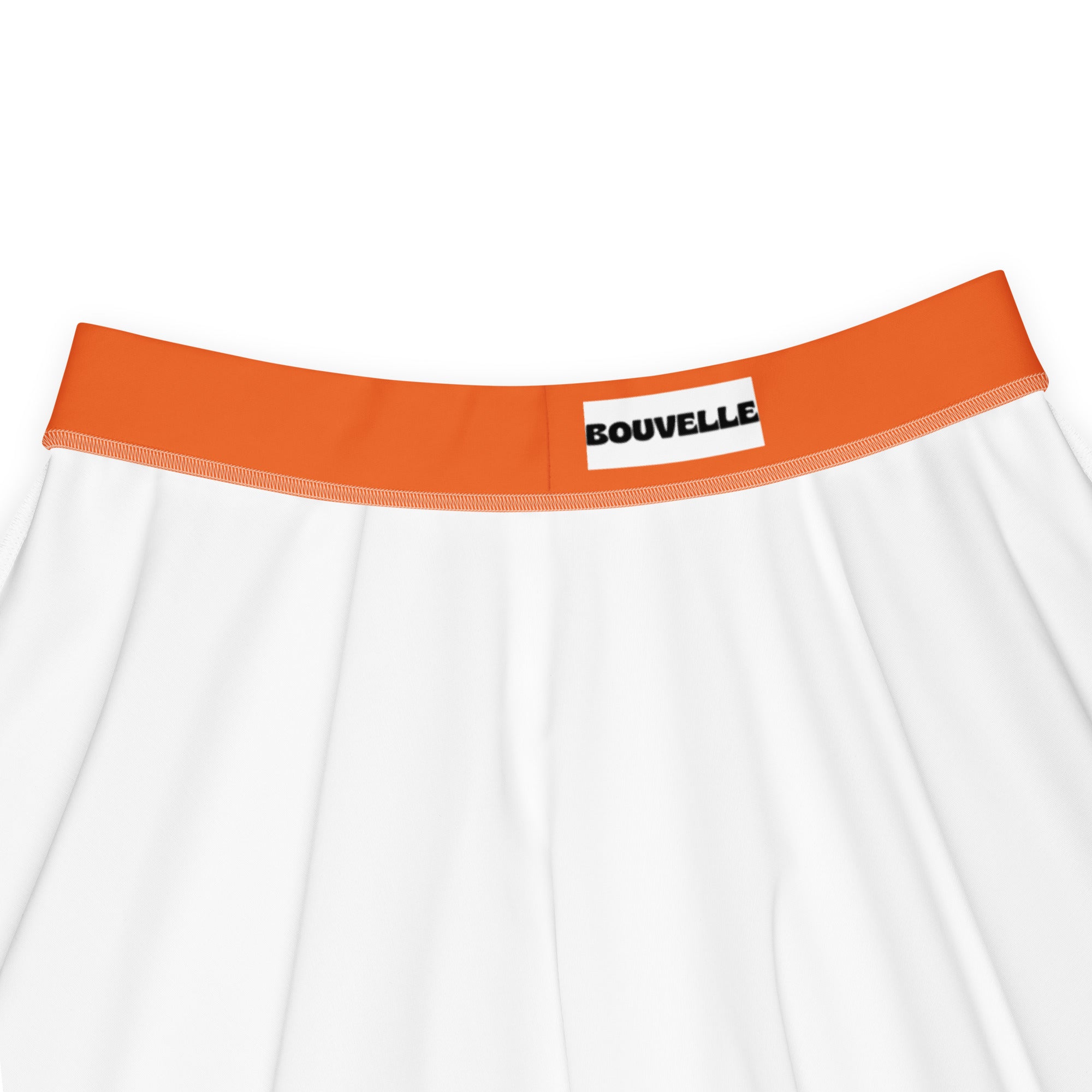 White briefs with orange elastic waistband and black bouvelle label shown with women’s orange skater skirt in recycled fabric