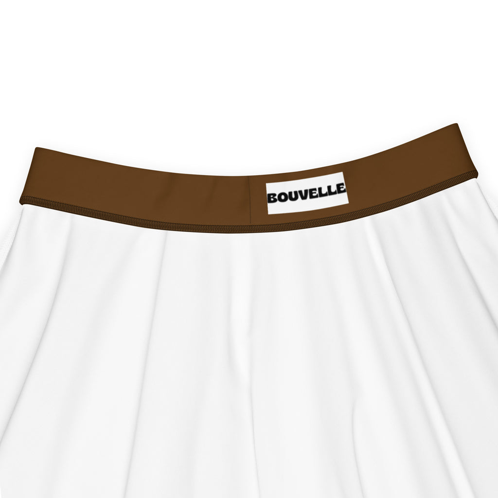 White fabric underwear with brown elastic waistband and bouvelle label paired with women’s brown skater skirt high waisted flowy upf 50 plus recycled fabric