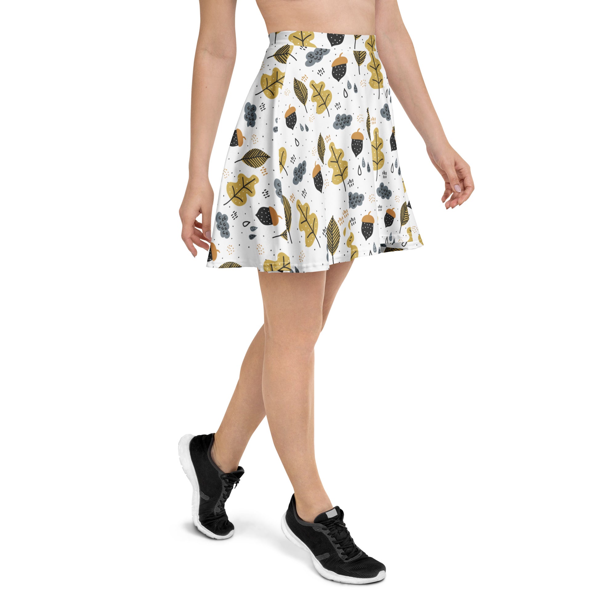 Women’s white a-line skater skirt with mustard yellow and dark gray autumn leaf and acorn print made from recycled fabric