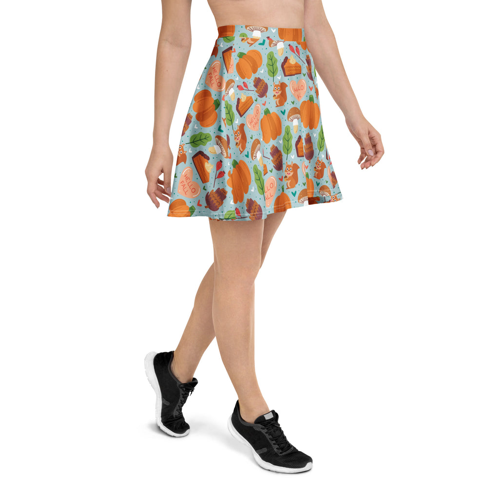 Women’s hello fall skater skirt with flowy high waisted light blue fabric featuring autumn pumpkins pies squirrels and leaves
