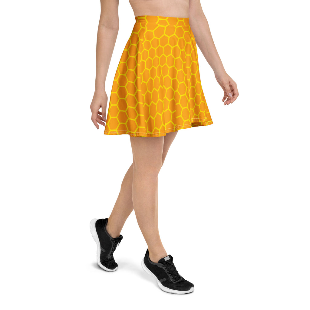 A vibrant yellow honeycomb skater skirt with flowy high waist made from recycled fabric and UPF 50 plus protection