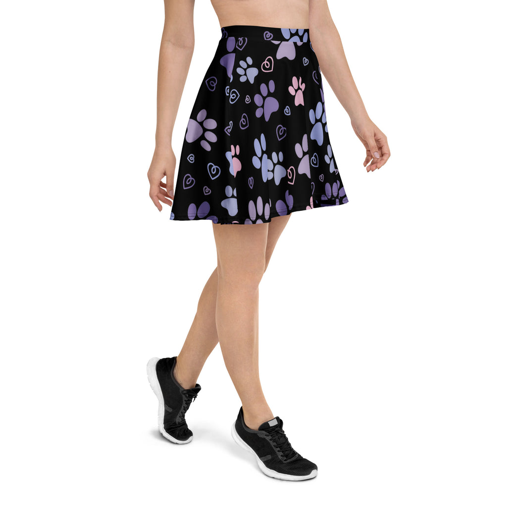 Women’s black pleated skater skirt with purple and pink paw prints and hearts made from recycled fabric with upf 50+