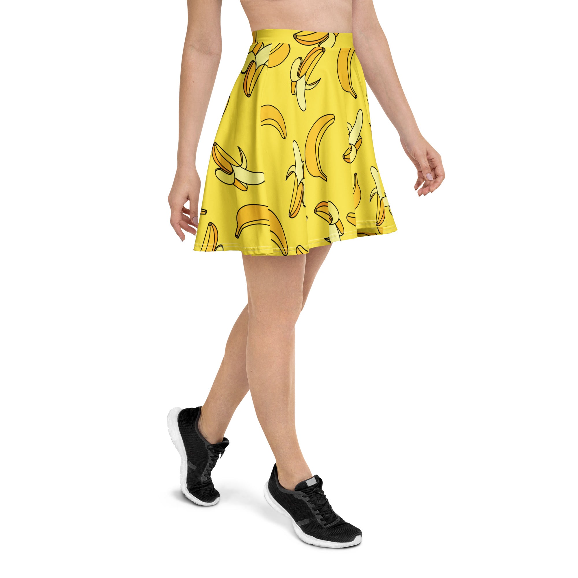 A bright yellow banana-print flared skater skirt made from recycled fabric with UPF 50 plus protection