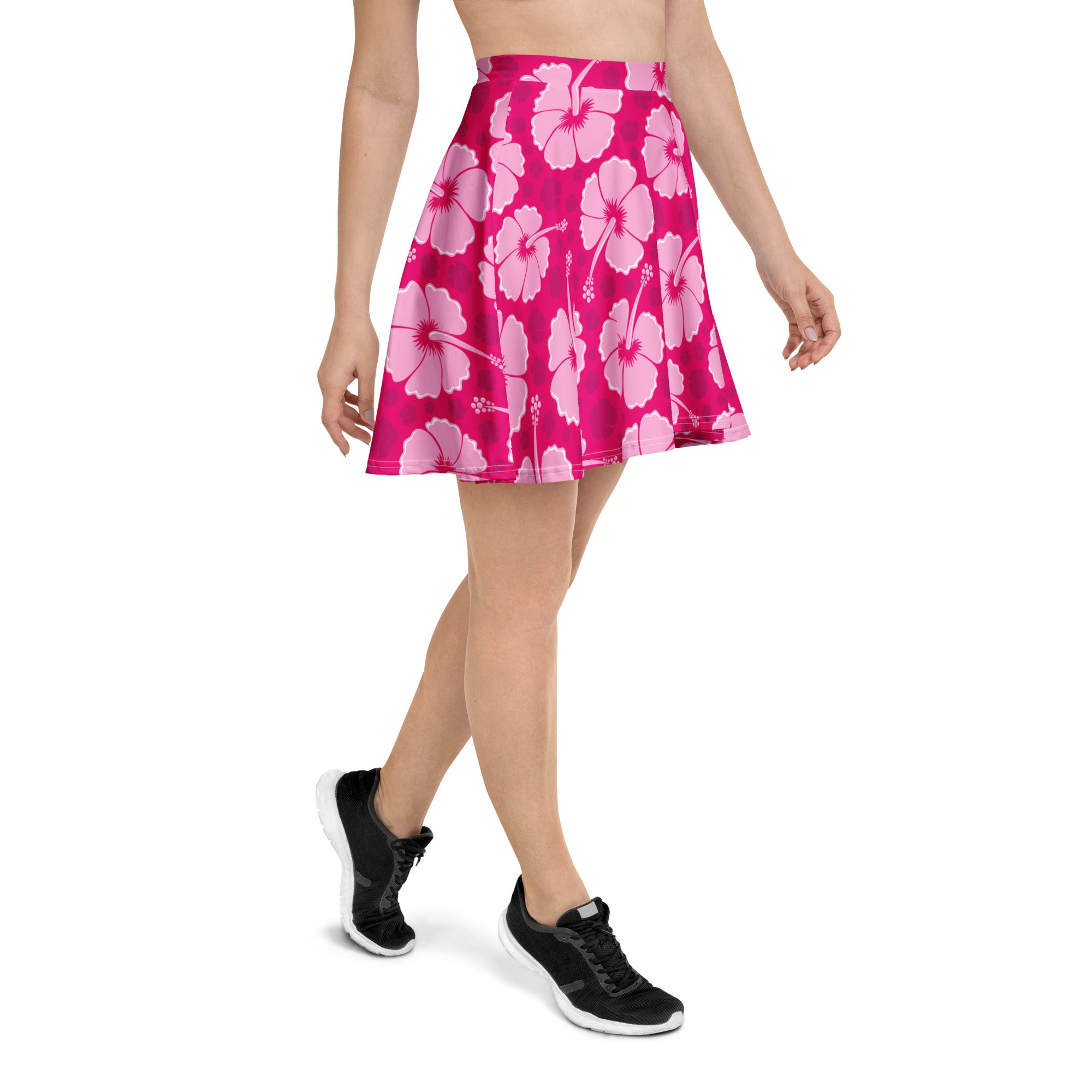 A vibrant pink hibiscus skater skirt with high waisted flowy design made from recycled fabric with UPF 50 plus