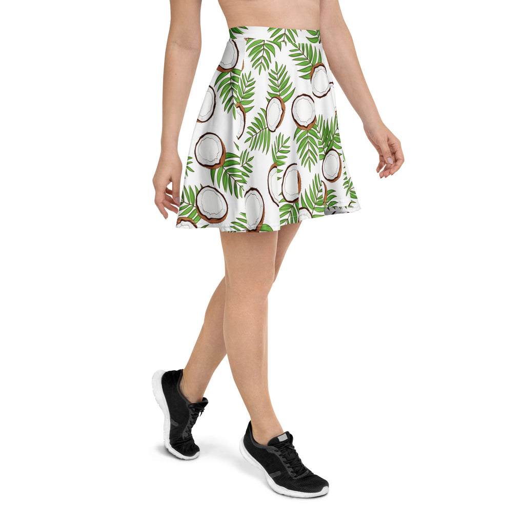 White skater skirt with vibrant tropical green palm leaves and halved coconuts print made from recycled fabric