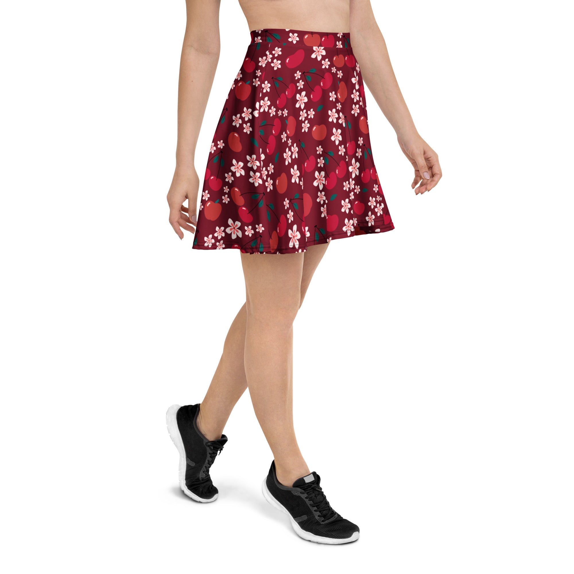 Women’s burgundy cherry blossom skater skirt with flared deep red fabric featuring pink cherry blossoms and stylized apples