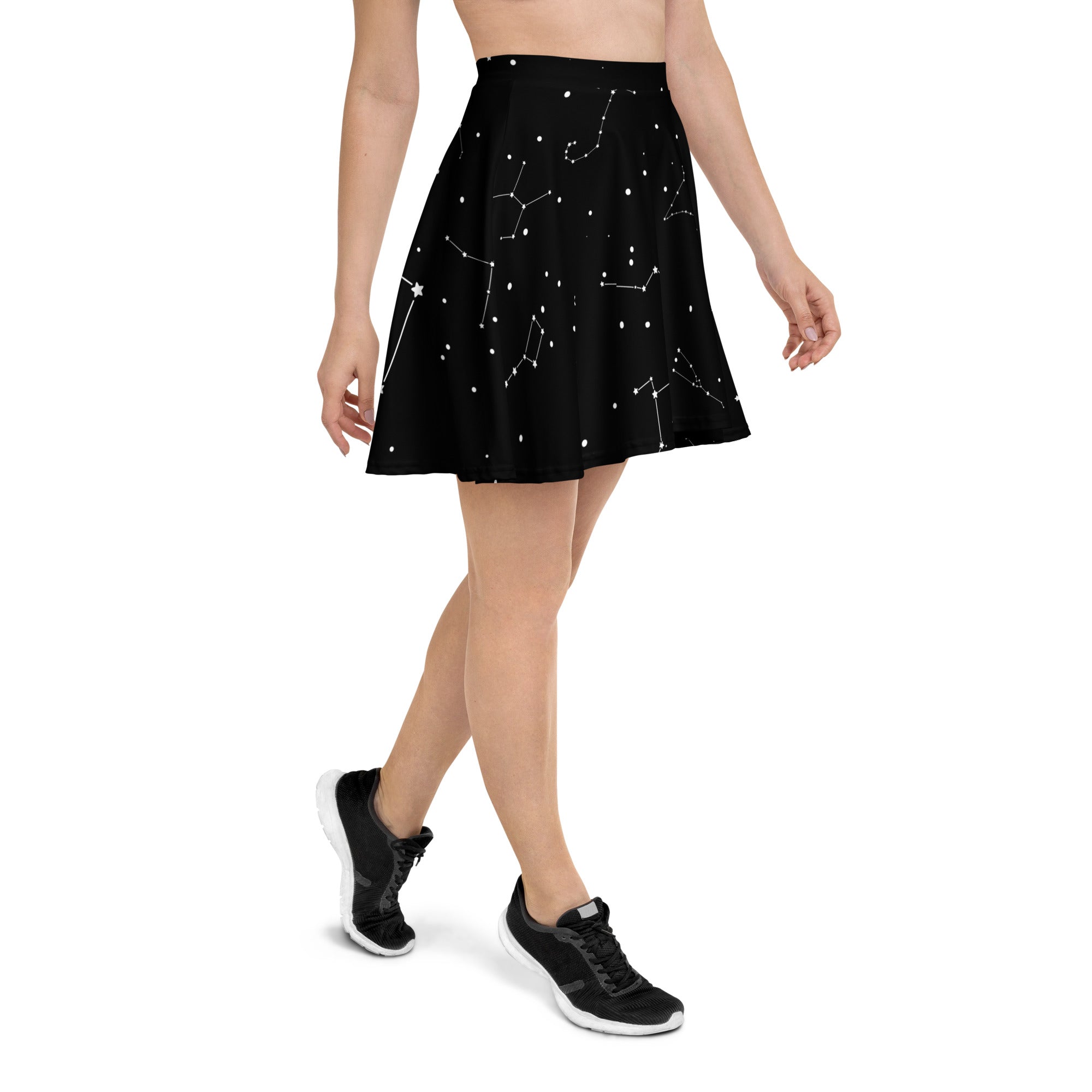 Women’s black pleated skater skirt with white constellation and star pattern made from recycled fabric with upf 50+