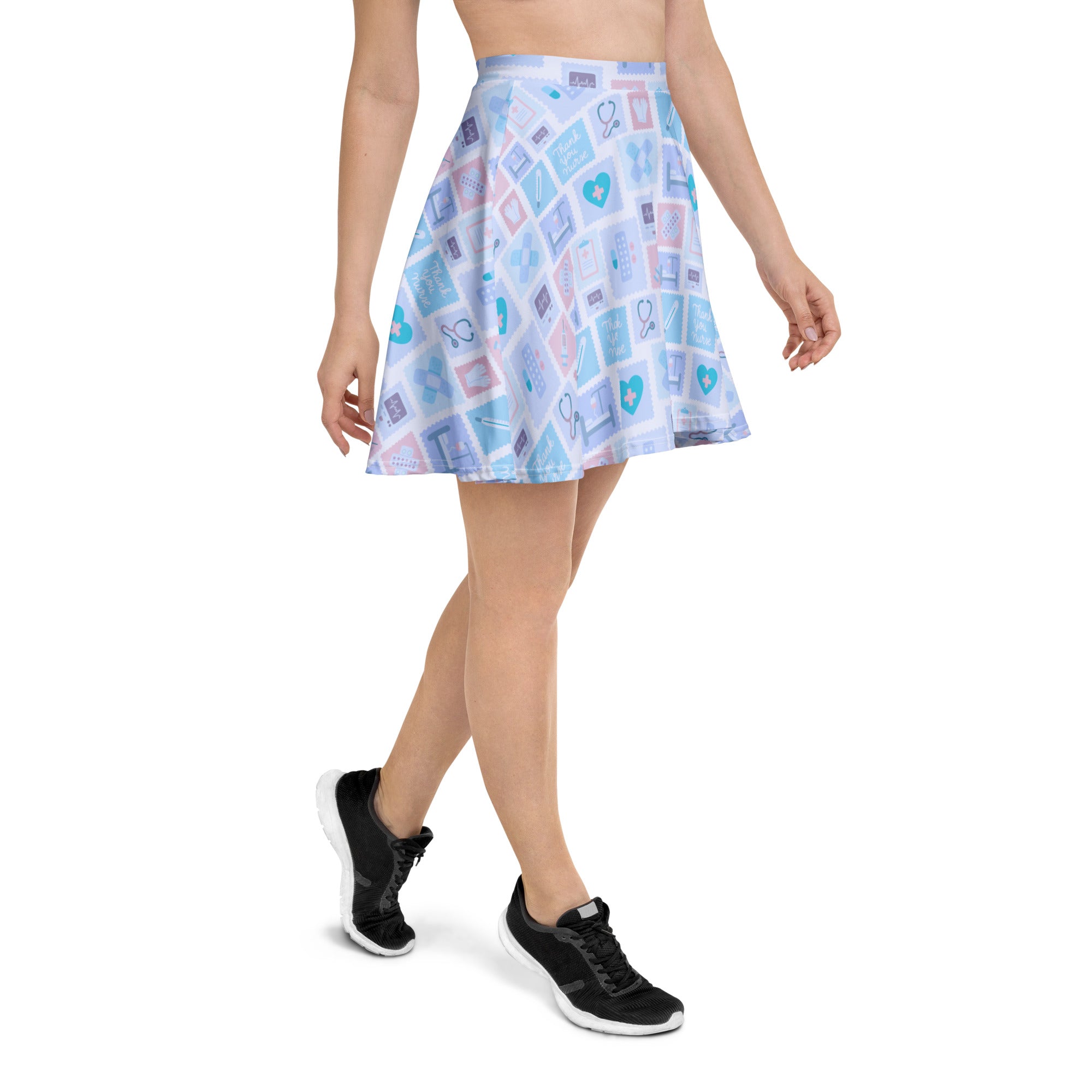 Women’s blue nurse icon skater skirt with light blue and pink medical print, flowy high waisted fabric with upf 50 plus and recycled material
