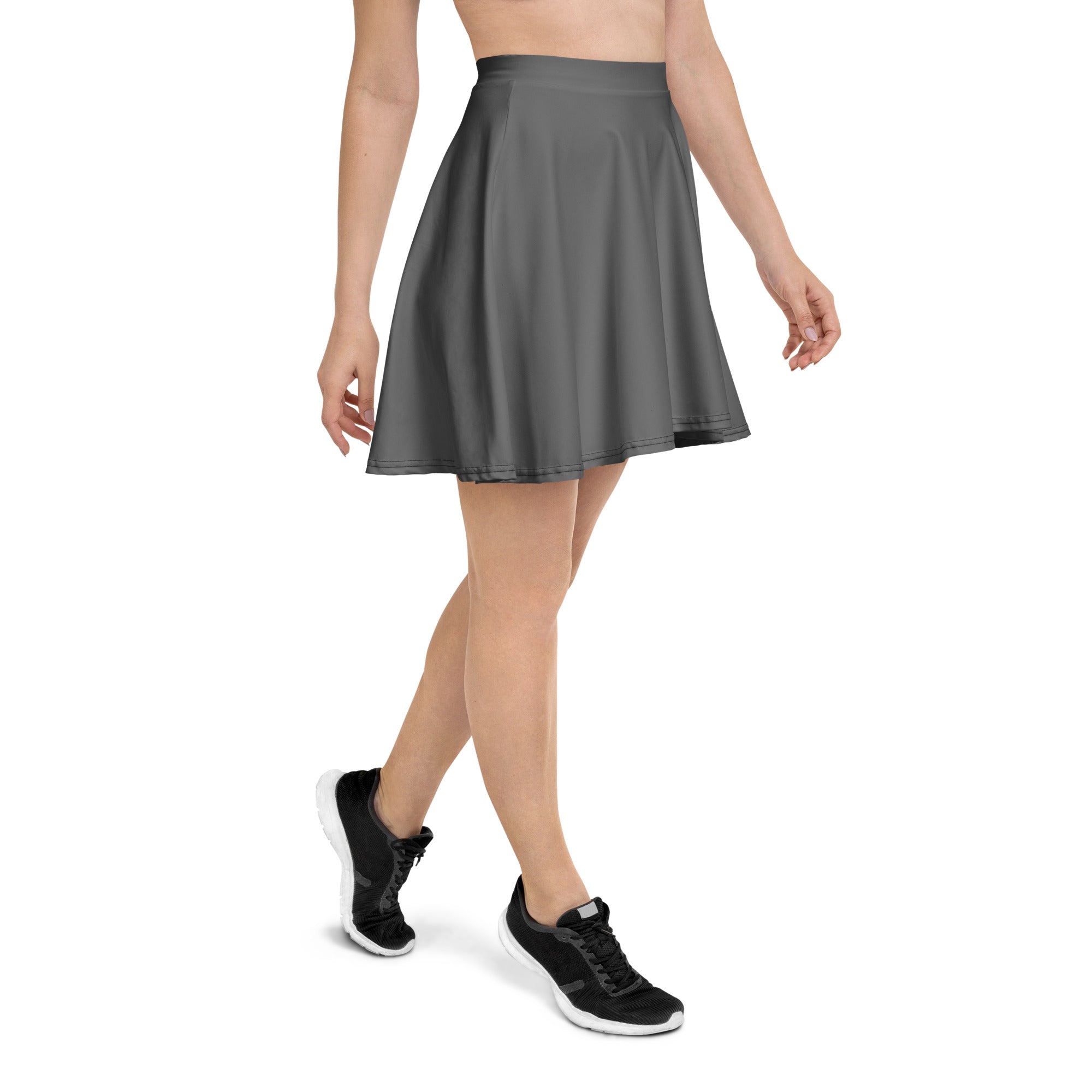 A sleek dark gray high waisted pleated skater skirt with flowy recycled fabric and UPF 50 plus protection