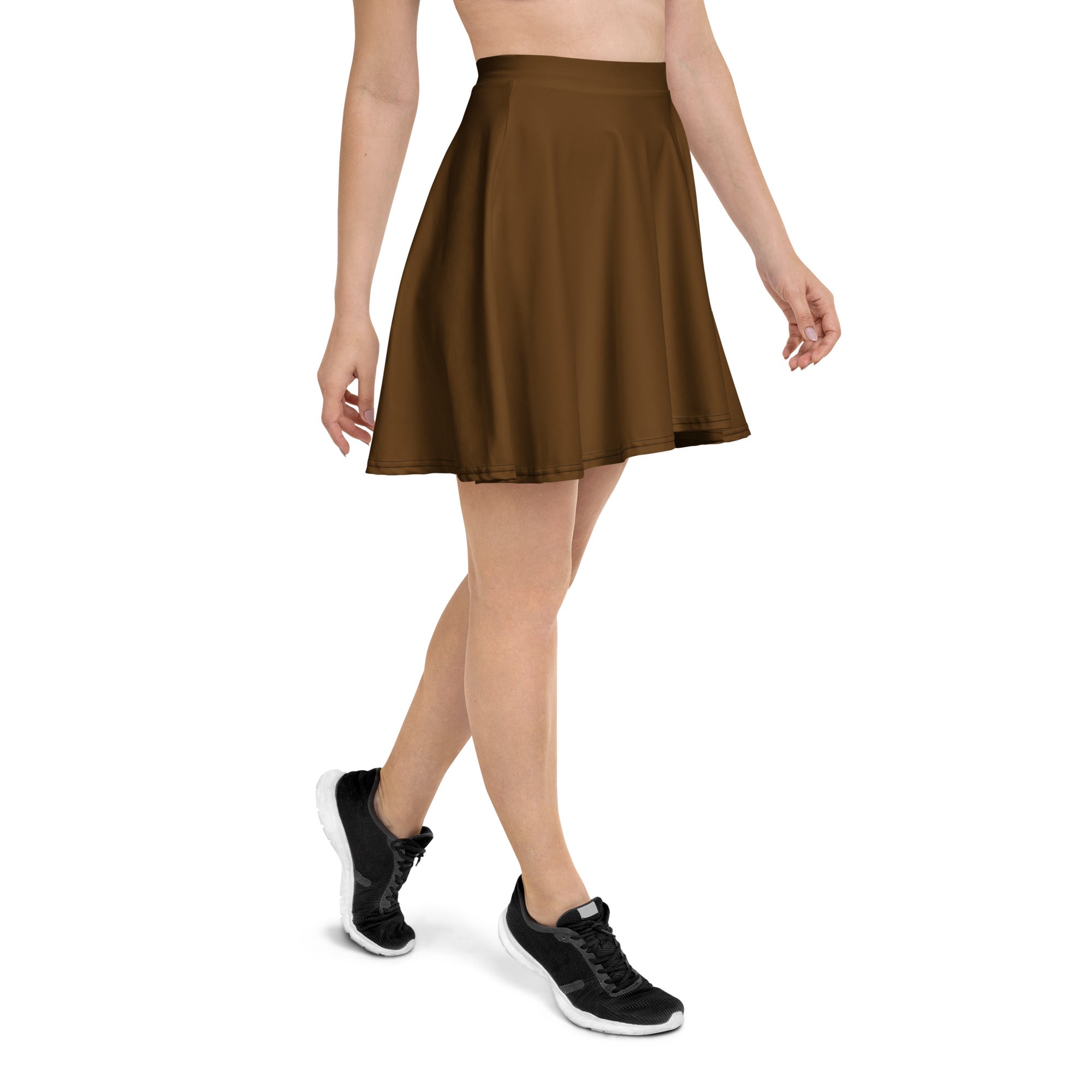 A women’s brown pleated skater skirt with flowy fabric high waisted with upf 50 plus and recycled material