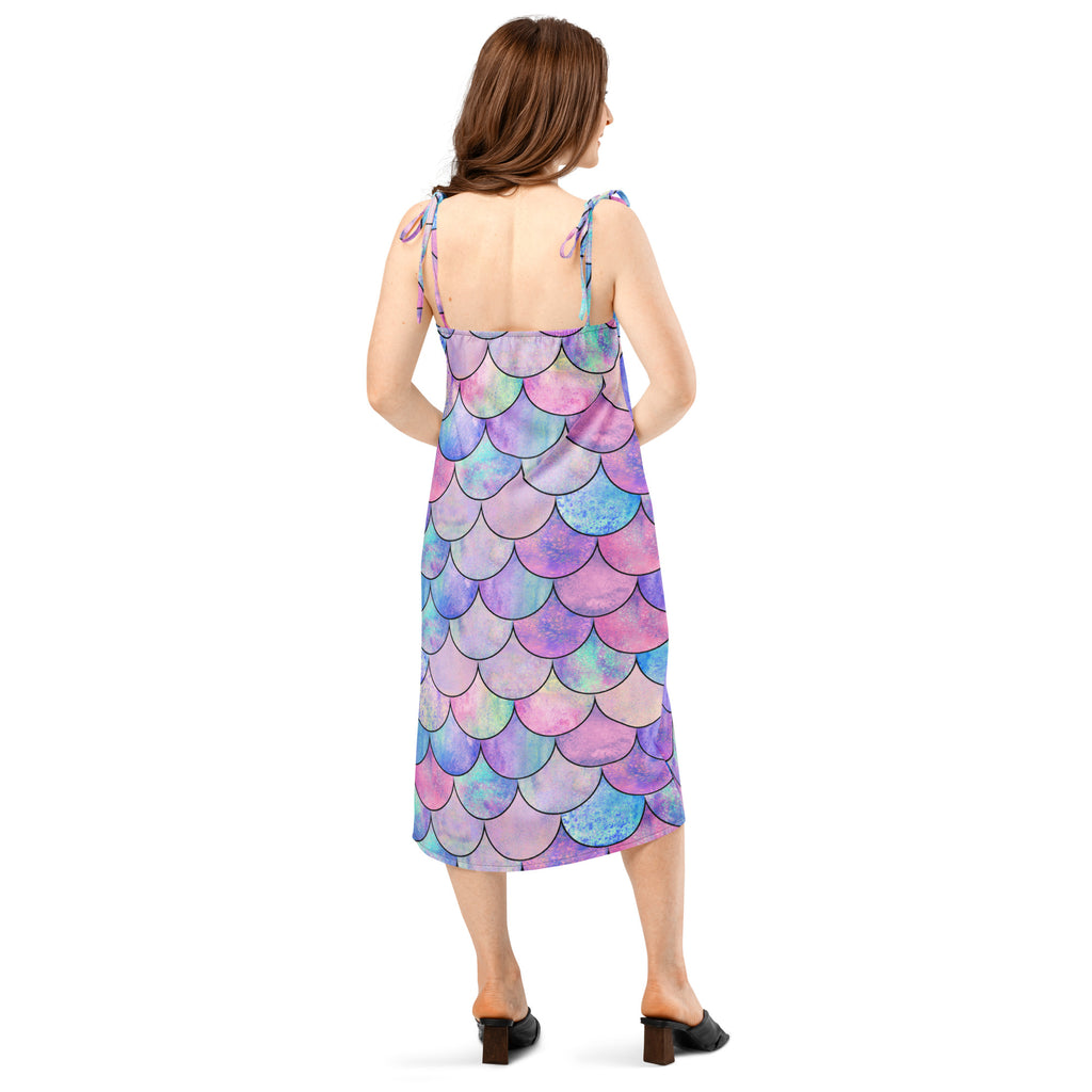 Women’s pastel mermaid slip midi dress with adjustable tie straps and built-in bra featuring iridescent purple pink blue scales