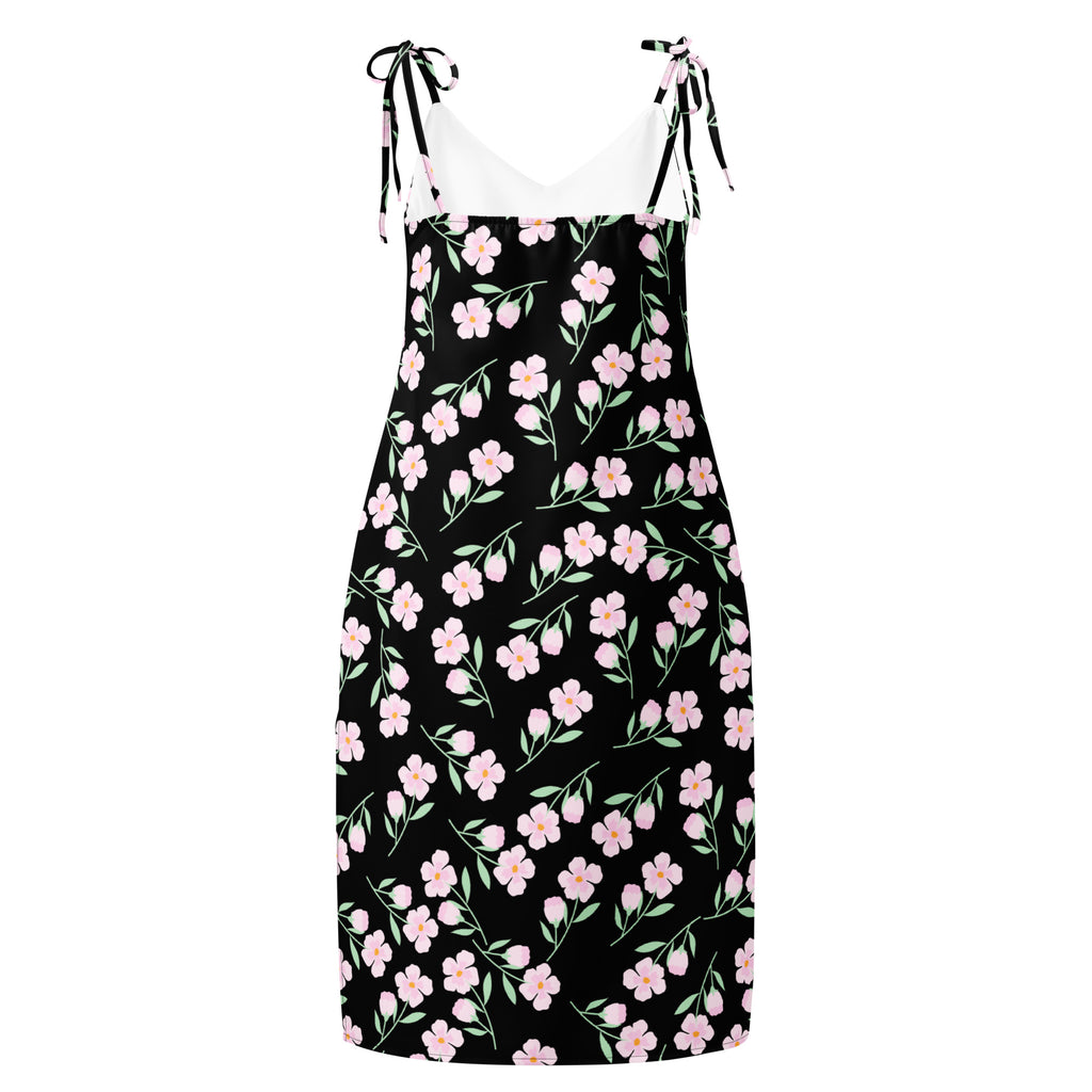 Women’s black floral slip midi dress with pink blossoms green stems and adjustable tie-back straps shown from back