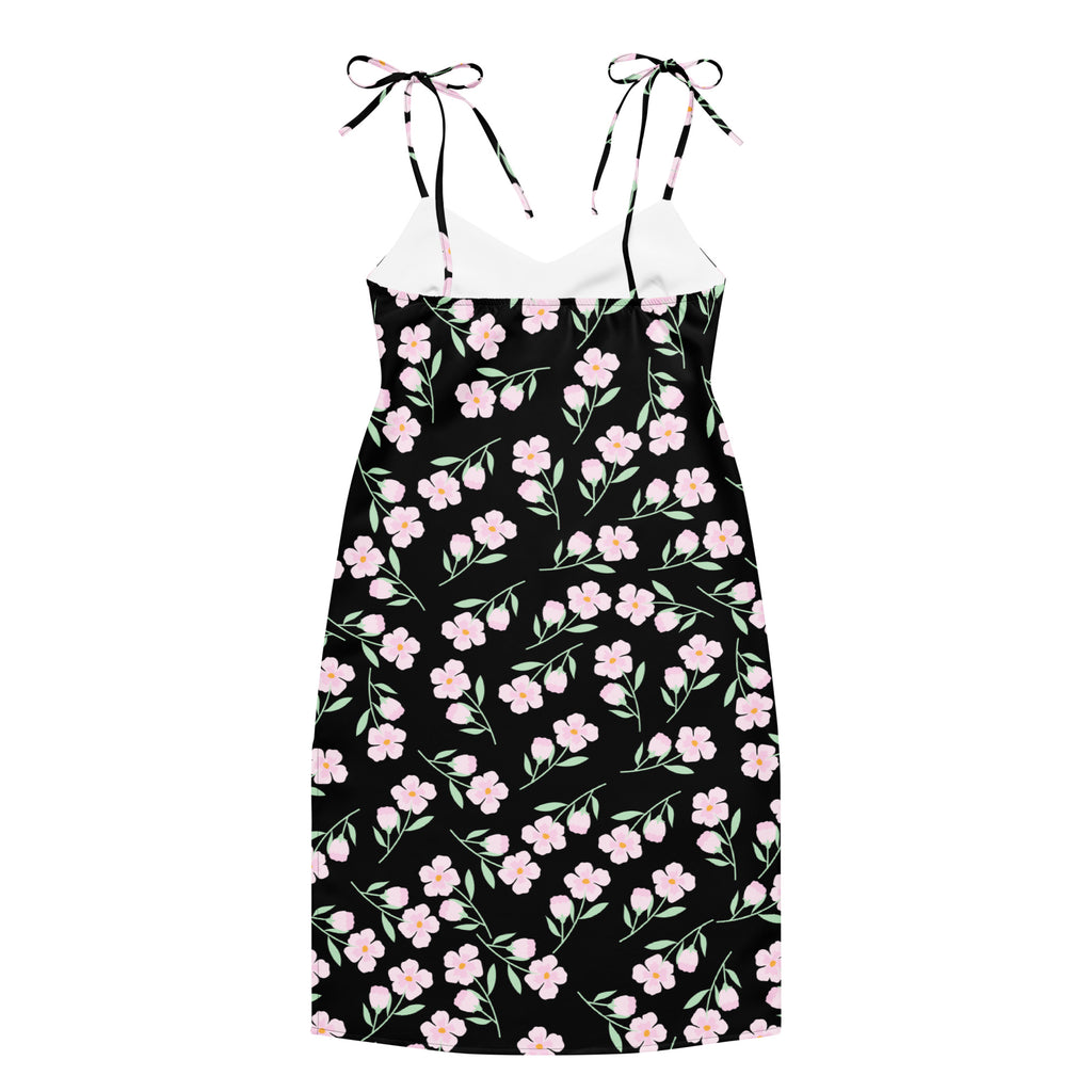 Women’s black floral slip midi dress with delicate pink blossoms green stems and adjustable tie-back straps back view