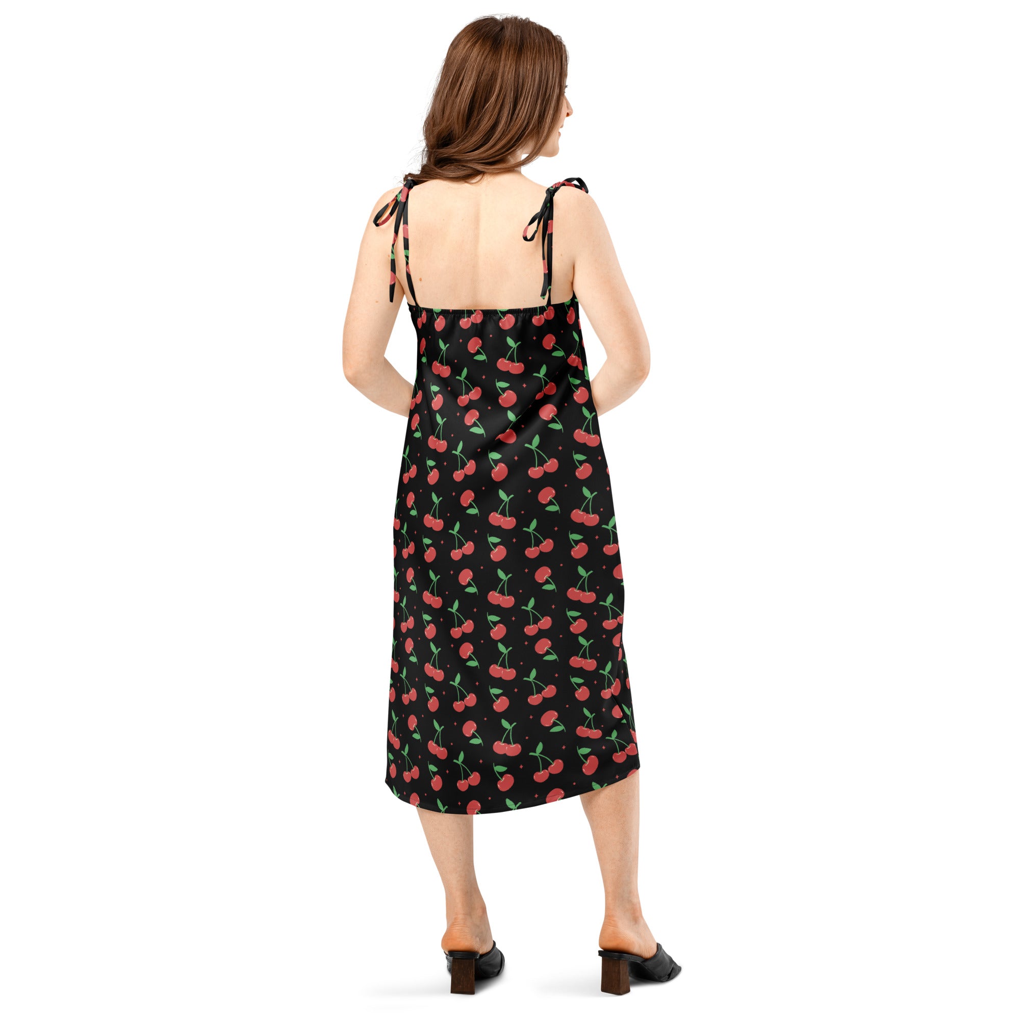 Women’s black cherry print slip midi dress with adjustable tie-back straps and built-in bra shown from the back