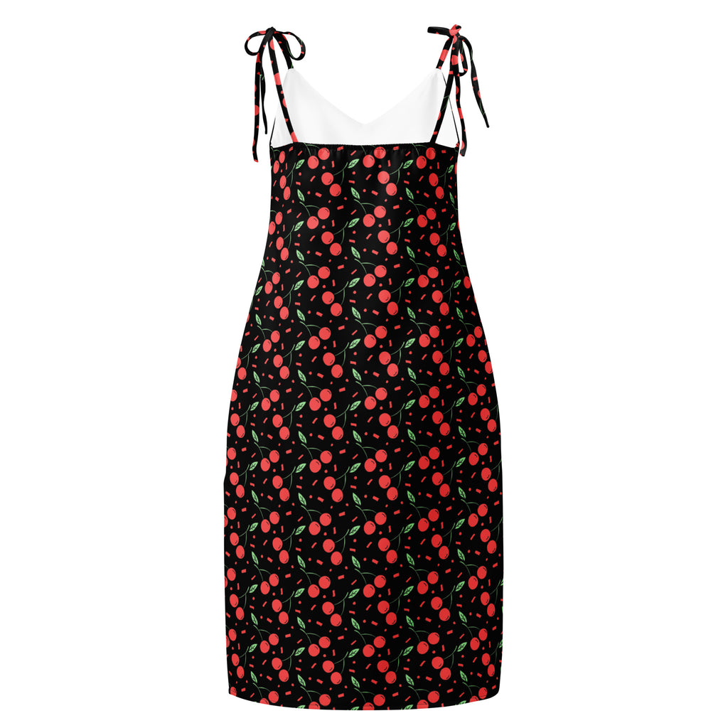 Women’s black cherry print mini slip dress with adjustable tie straps and built in bra visible in front view
