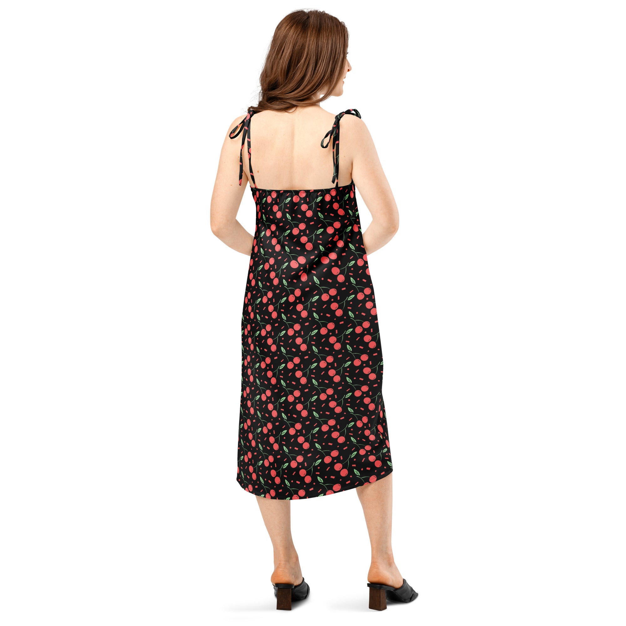 Women’s black cherry-print midi slip dress with thin adjustable tie-back straps and built-in bra shown from the back