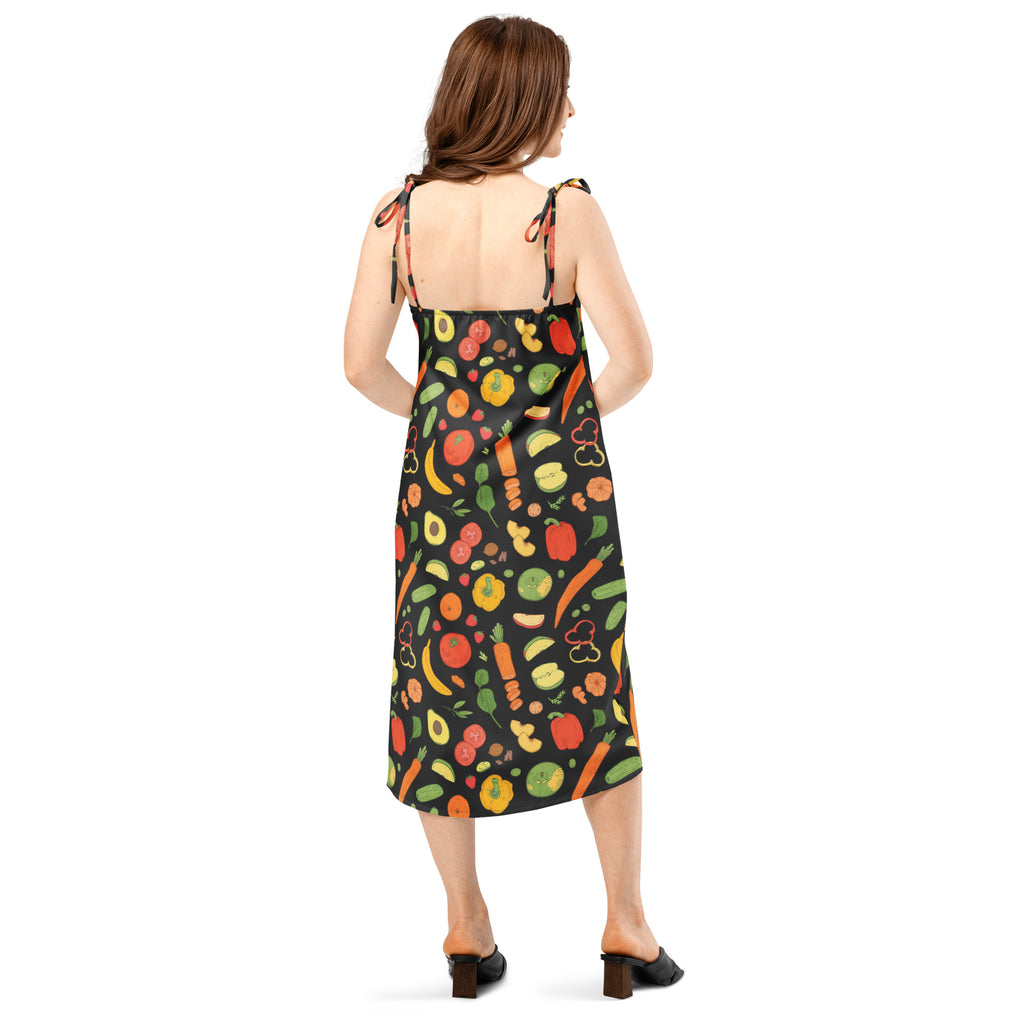 Women’s black midi slip dress with colorful fruit and vegetable prints on satin fabric with adjustable tie straps and built in bra