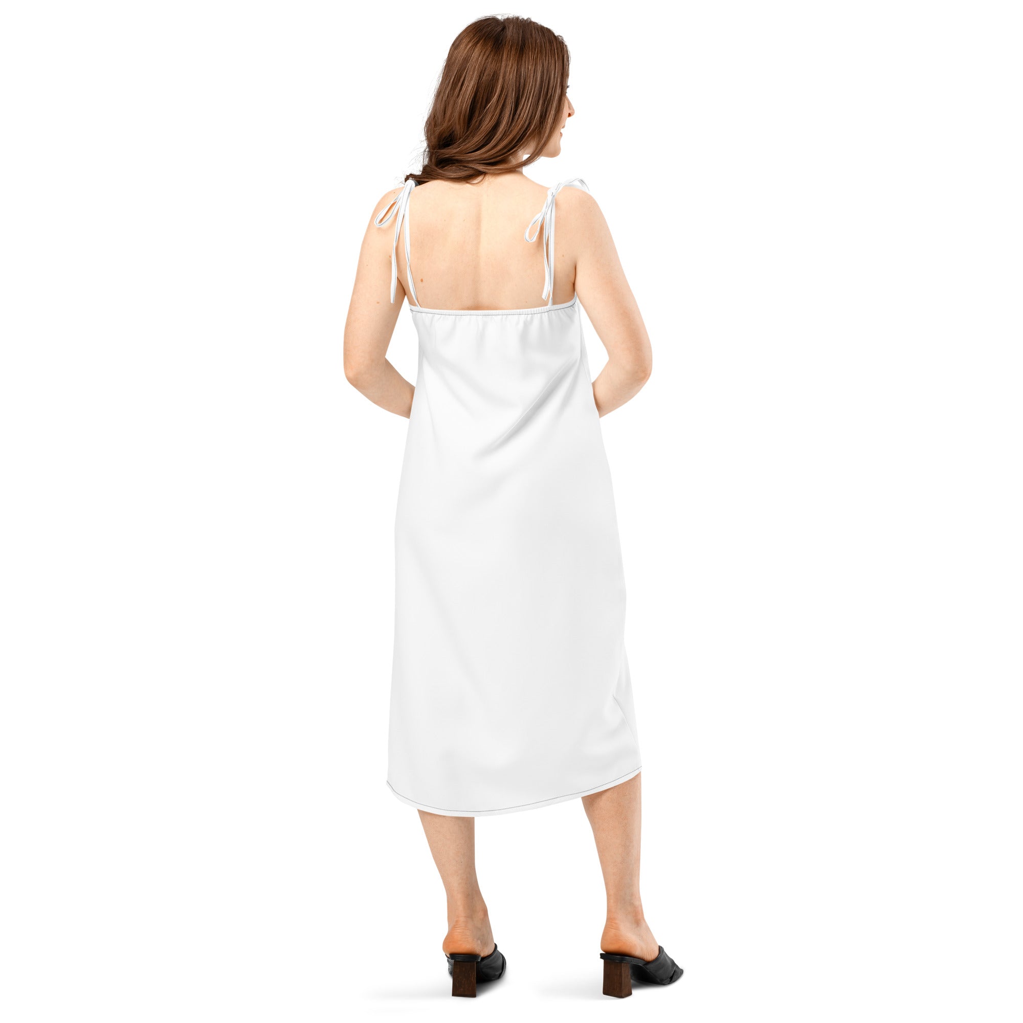 White sleeveless midi slip dress with adjustable tie-back straps and smooth satin-like finish with built-in bra