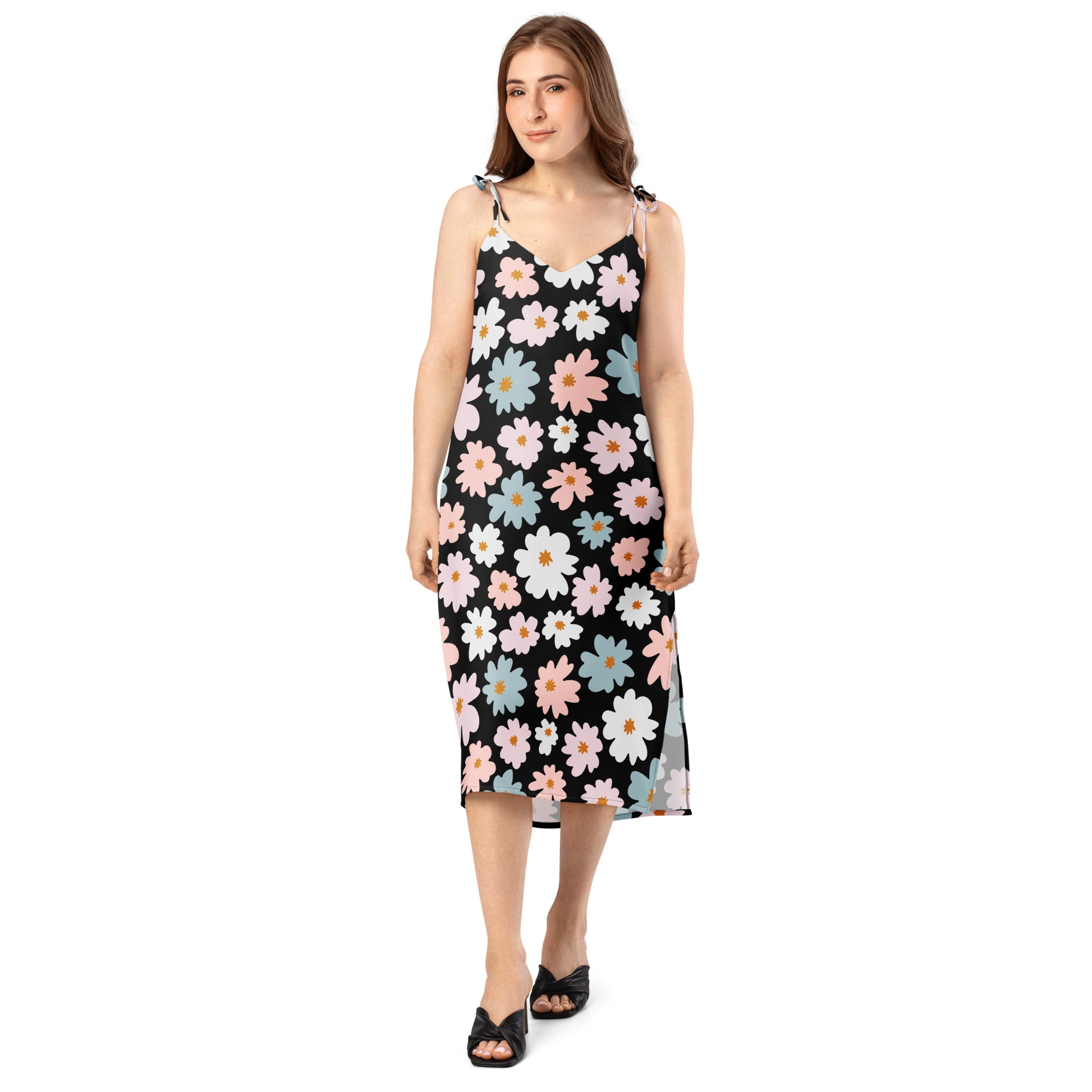 Women’s retro floral slip dress in black with delicate spaghetti straps and vibrant pink white and blue daisy pattern midi dress