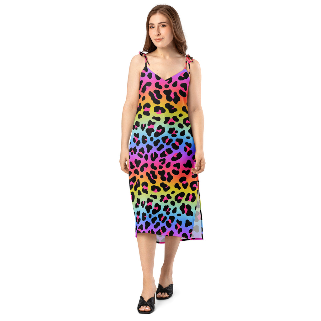 Woman wearing a colorful leopard print dress on a white background