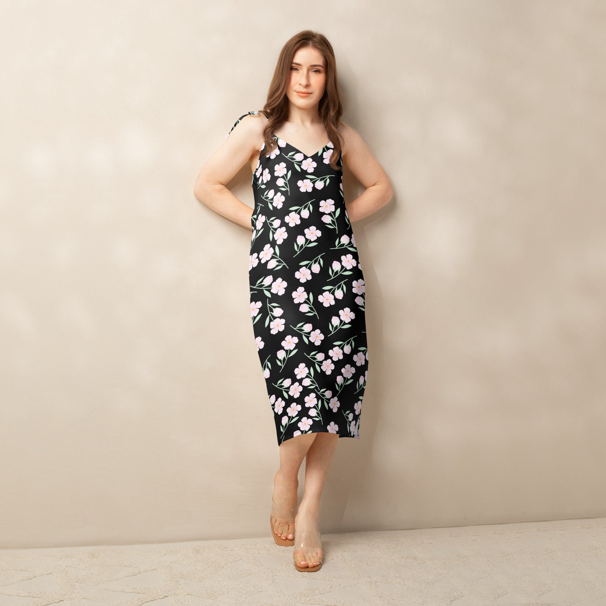 Women’s black floral slip midi dress with delicate pink blossoms green stems thin adjustable tie straps and built-in bra