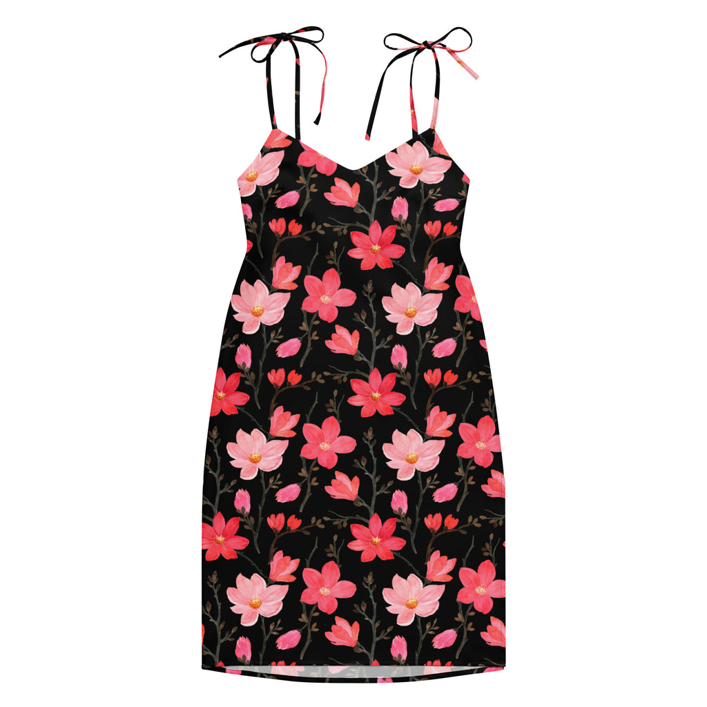 A black floral print midi sundress with adjustable tie straps and built in bra featuring pink and red blossoms