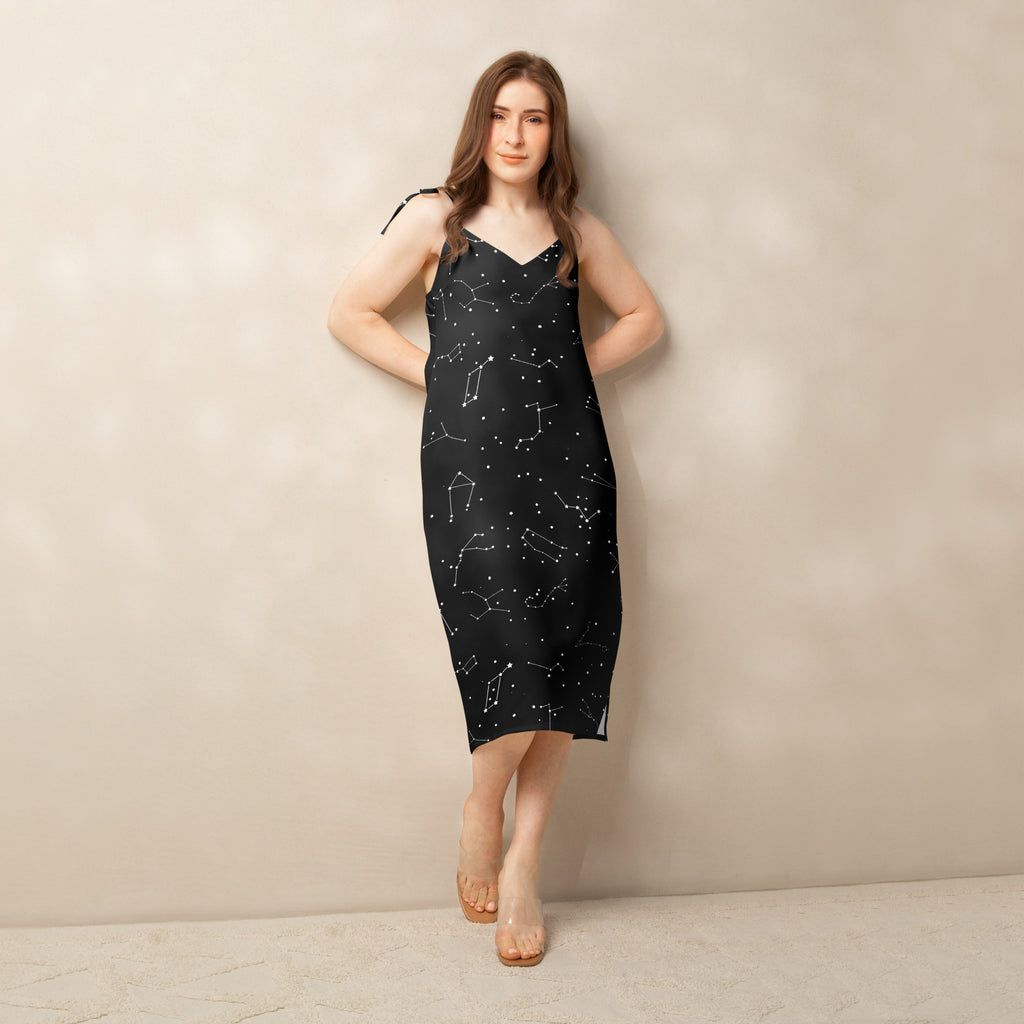 Black satin midi slip dress with white constellation pattern adjustable tie straps and built in bra for women