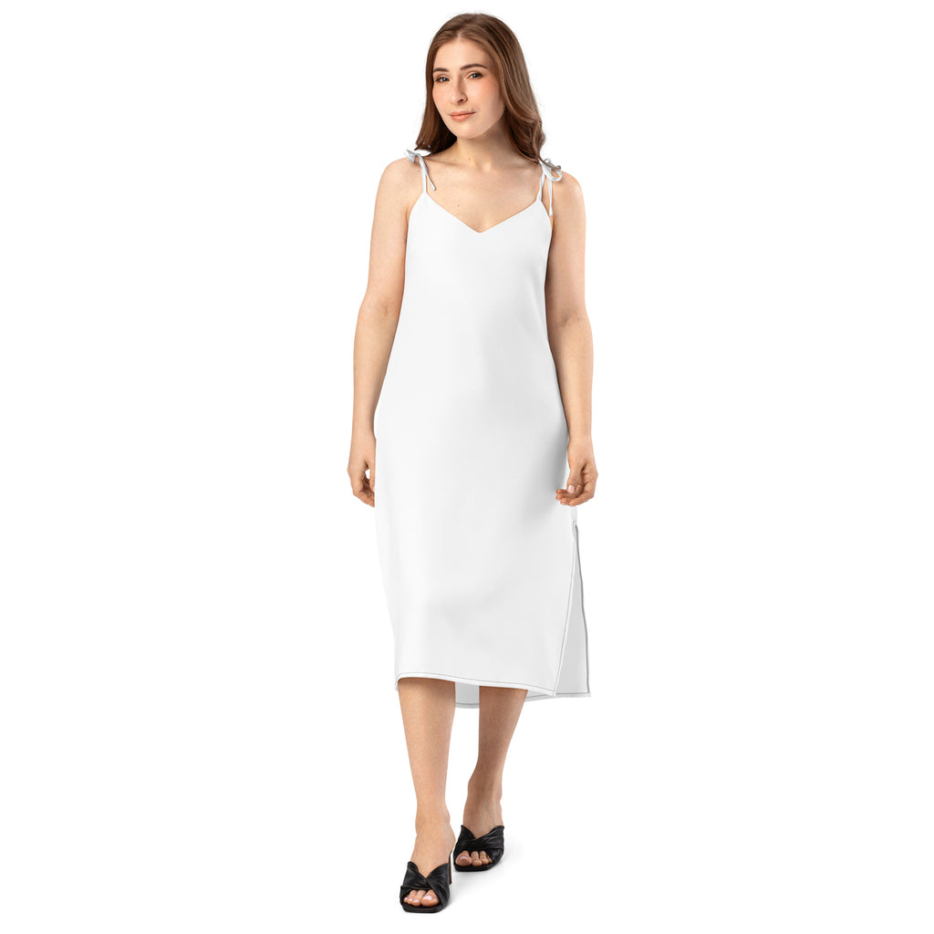 White sleeveless midi slip dress with adjustable tie straps built in bra and subtle side slit