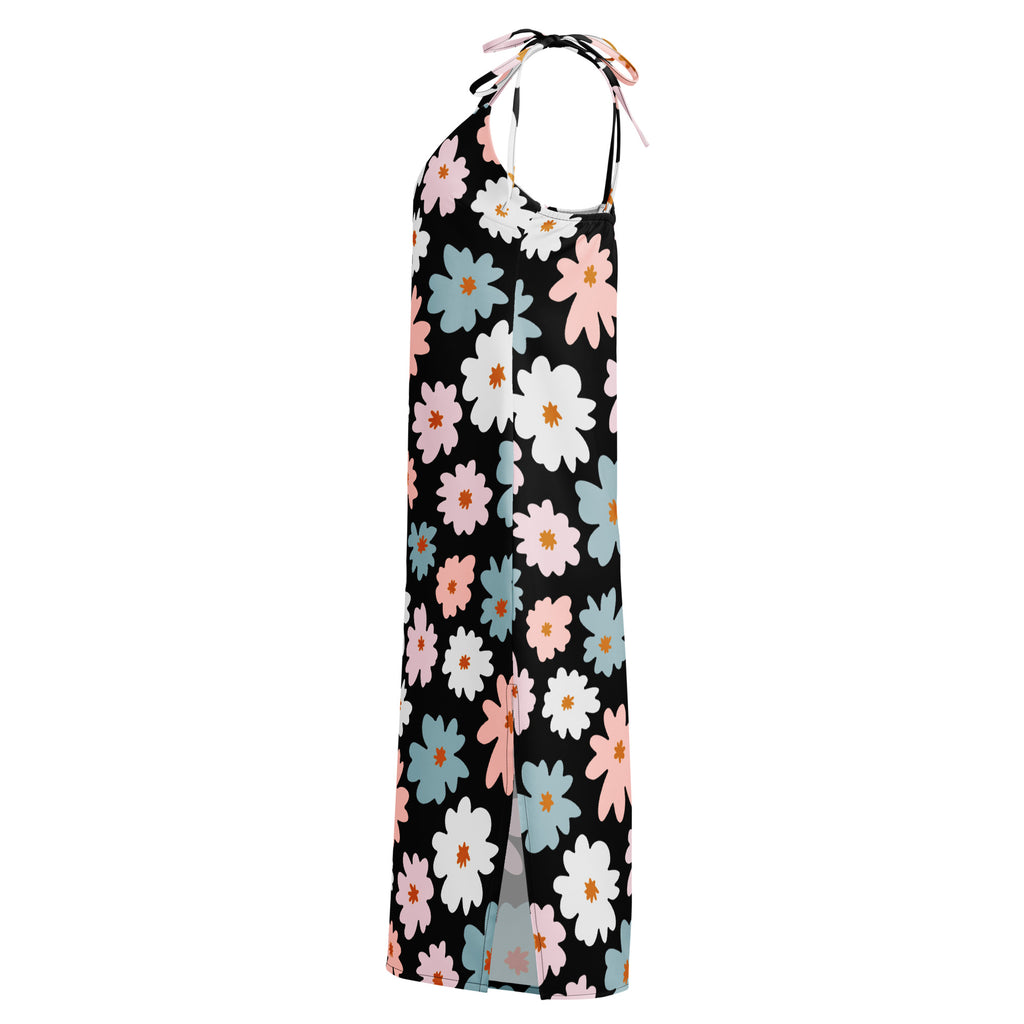 Black halter neck maxi dress with vibrant pink white and blue floral pattern featuring adjustable tie straps and built in bra