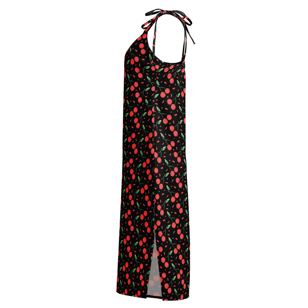 Women’s black halter-neck maxi dress with vibrant red cherry pattern and adjustable tie straps at neckline