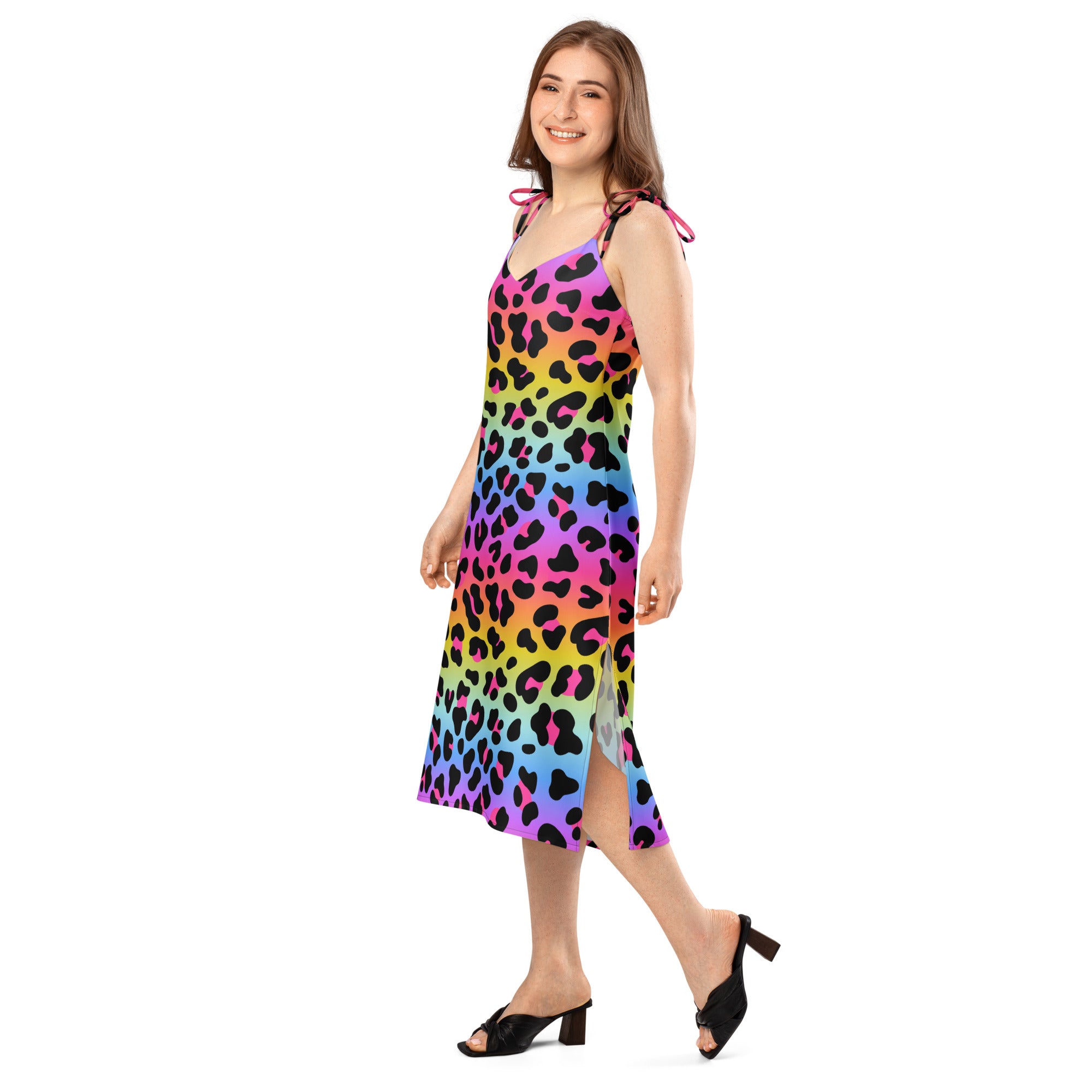 Woman wearing a colorful dress with a leopard print pattern on a white background