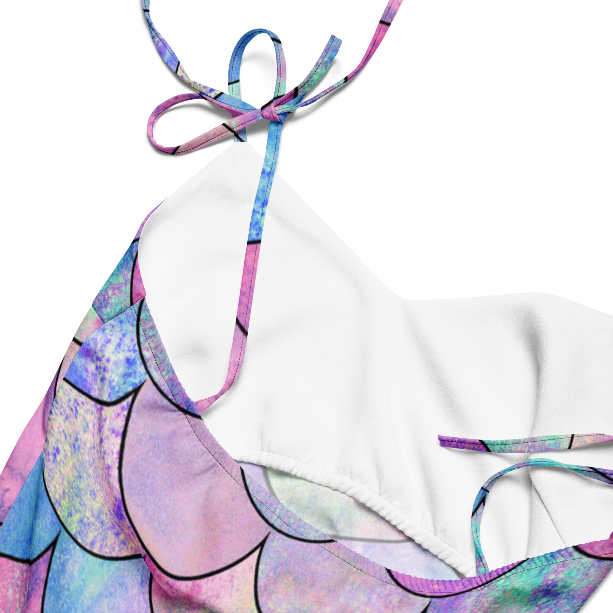 White halter top bikini with vibrant pink blue purple iridescent mermaid scale pattern along the sides