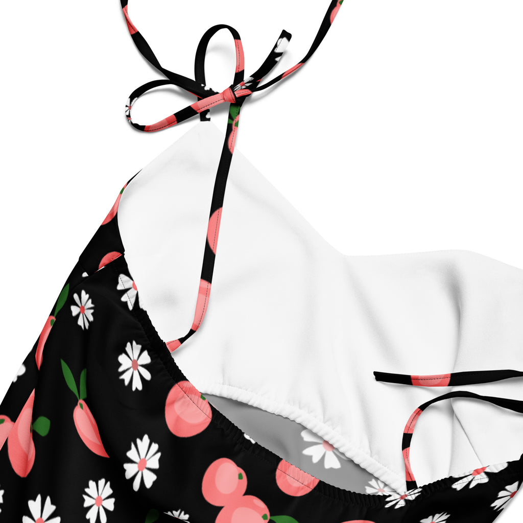 Black and white floral bikini top with peach print and adjustable straps tied in a bow for women’s peach print slip dress