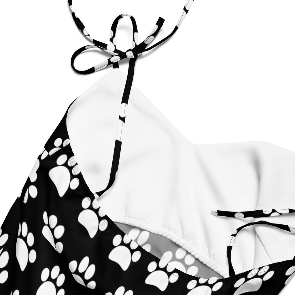 Women’s black and white paw print halter top bikini with adjustable tie straps and slip dress style design