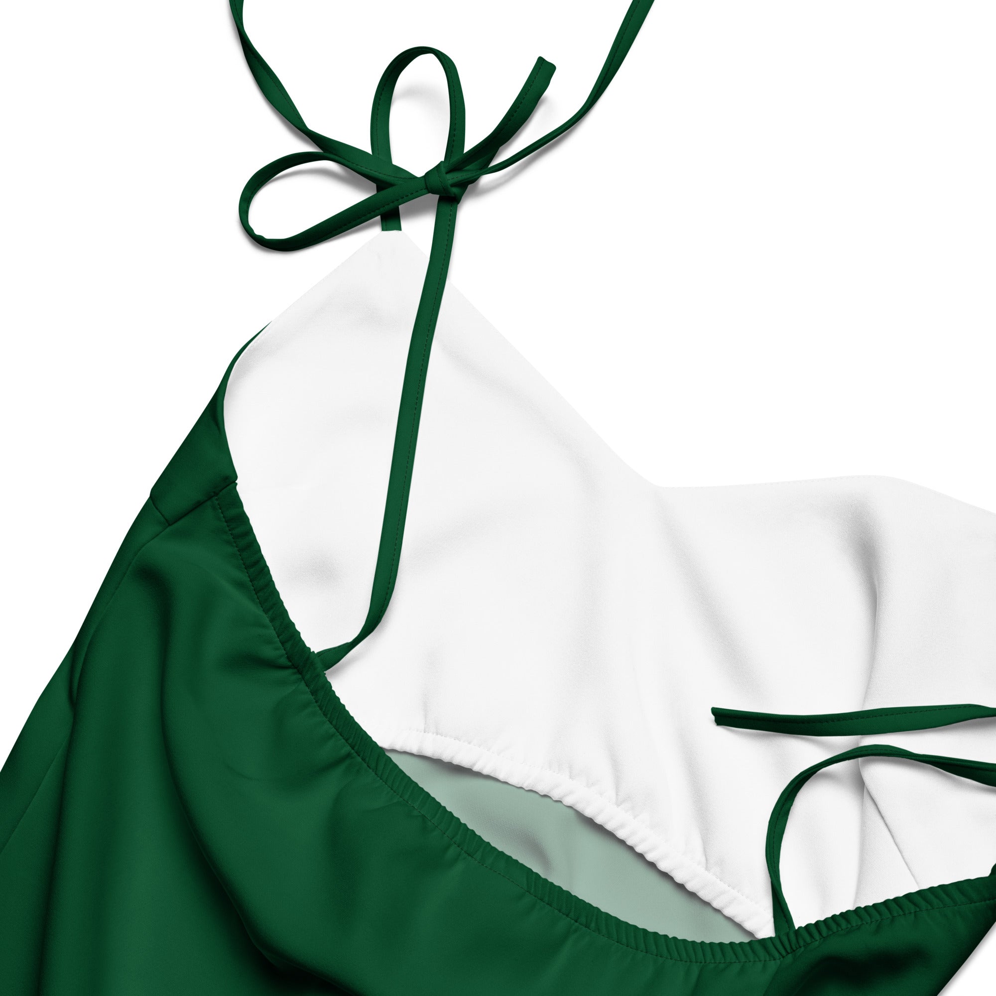 Green bikini top with thin straps on a white background