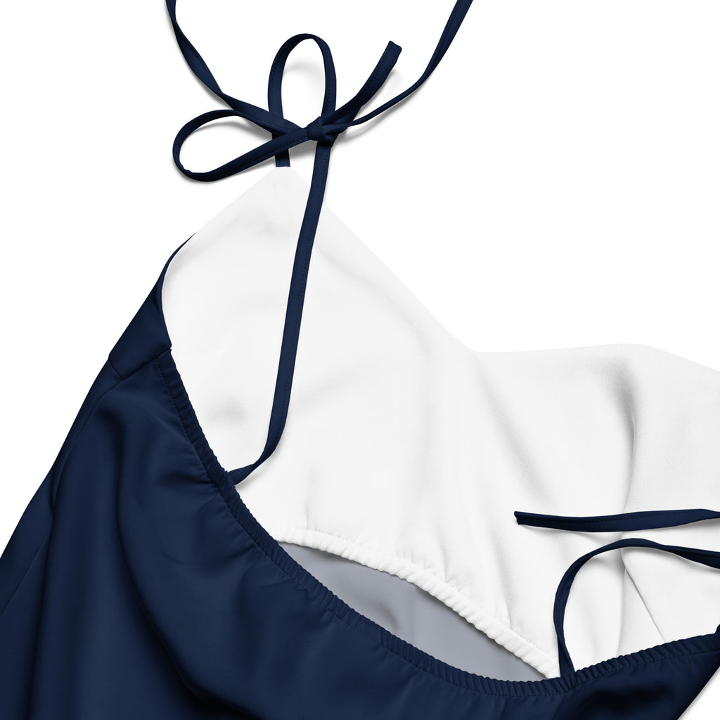 Bouvelle women's navy blue slip dress with adjustable tie straps and built-in bra, close-up neckline view