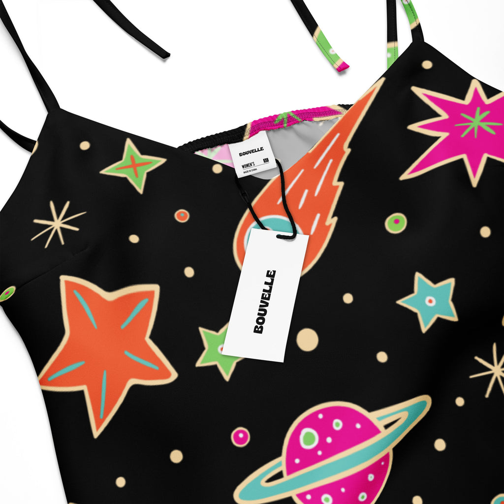Women’s retro neon space slip midi dress with black spaghetti straps and vibrant cosmic star planet print