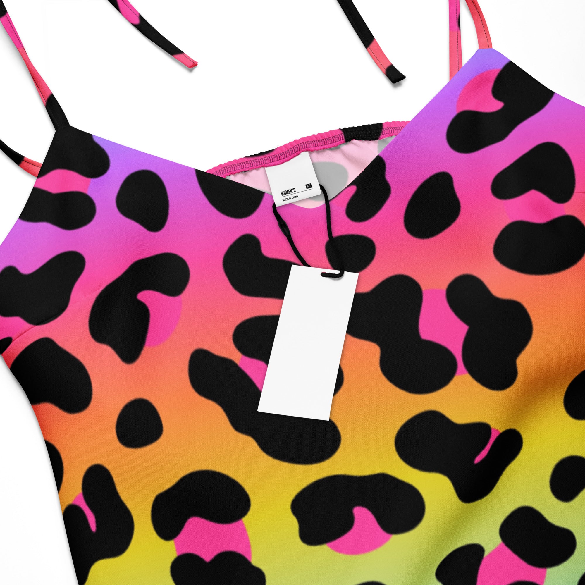 Colorful animal print top with a tag on a white background