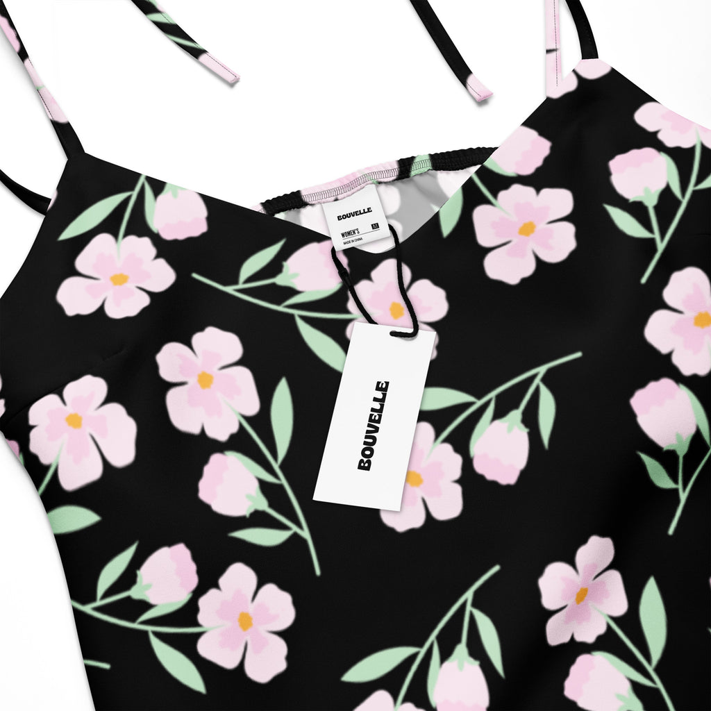 Women’s black floral slip dress midi dress with adjustable tie straps and built in bra featuring pink flowers and green leaves