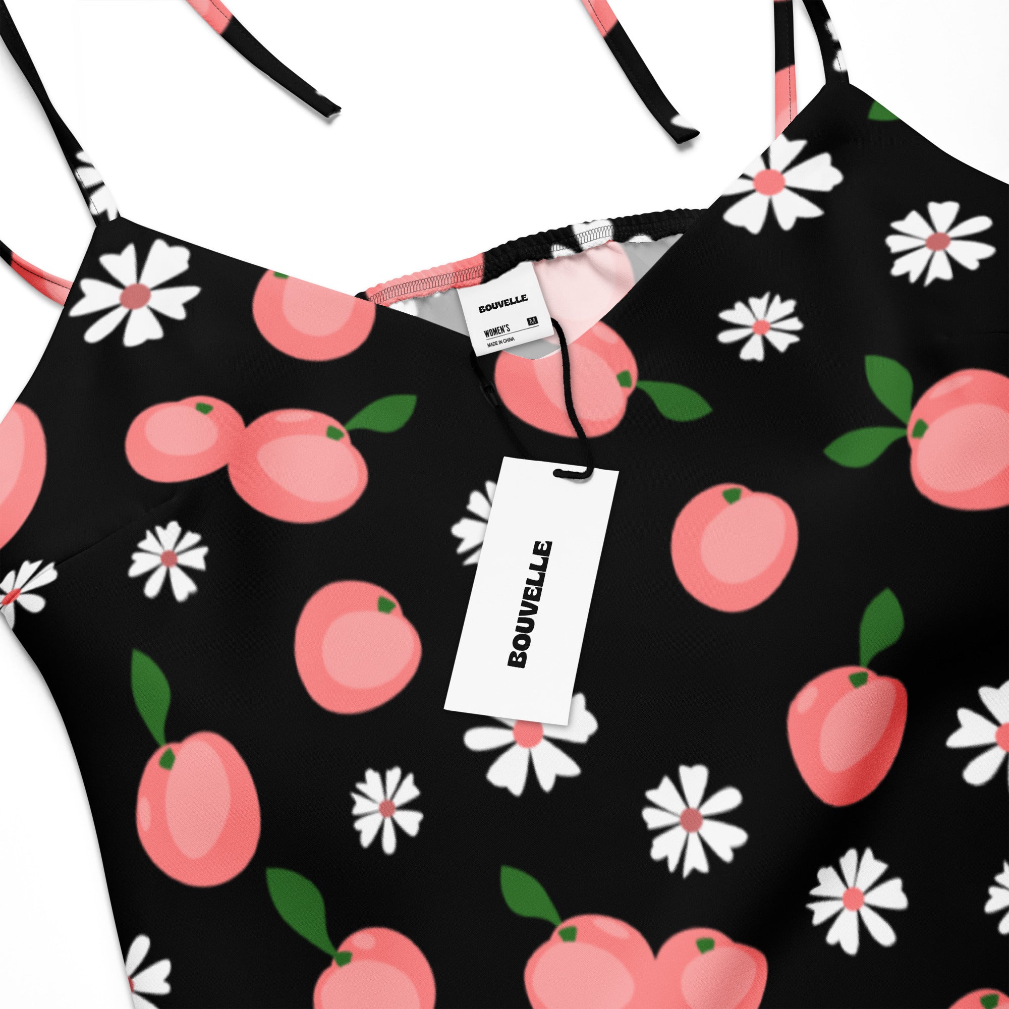 Black spaghetti strap midi slip dress by bouvelle with pink peach and white daisy print and adjustable tie straps
