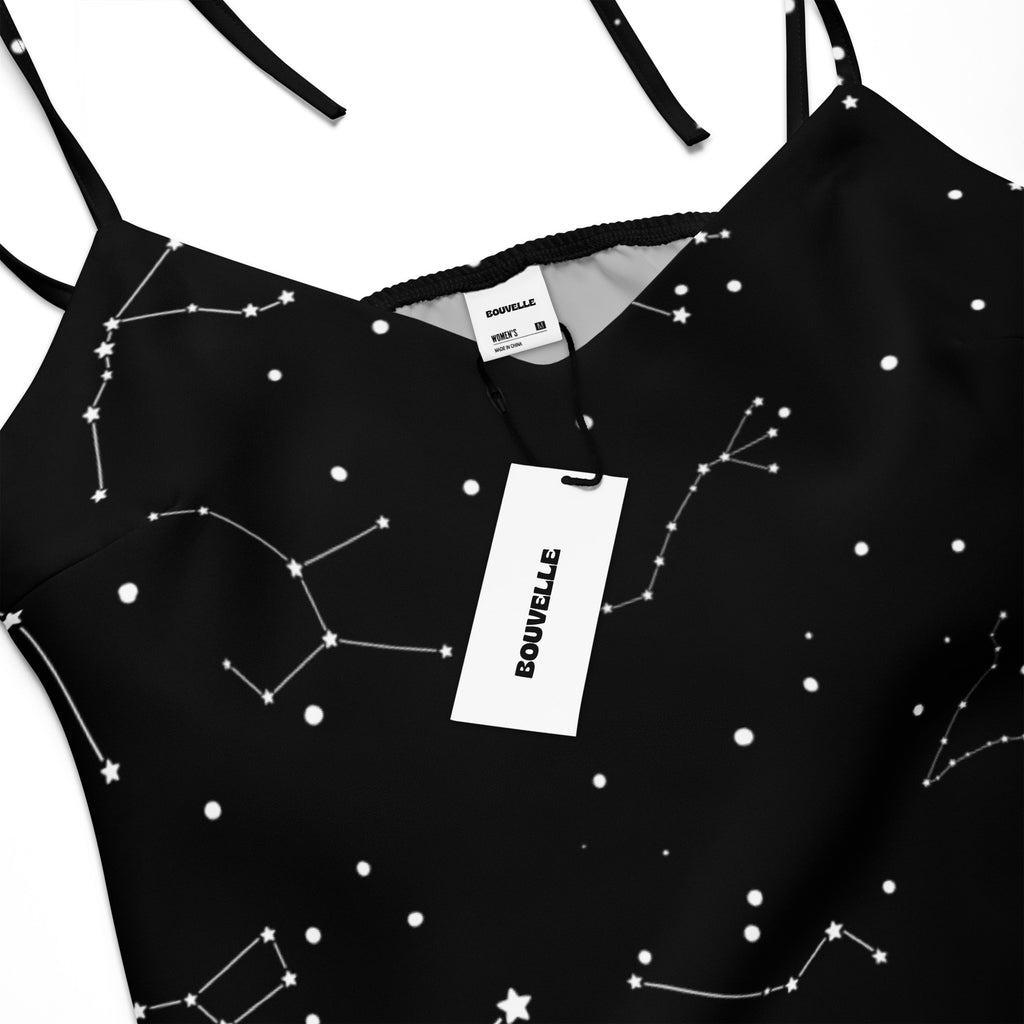 Black satin camisole with white constellation star print featuring thin adjustable tie straps and built in bra