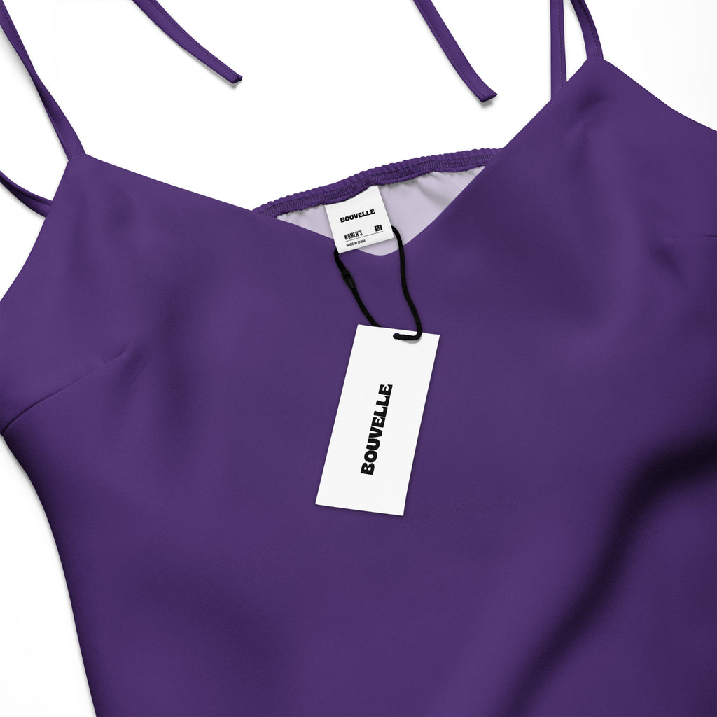 Purple dress with a visible brand tag on a white background
