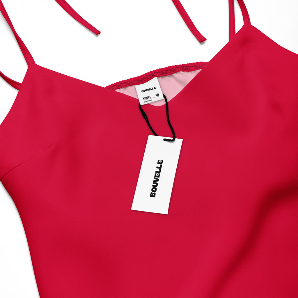 Red dress with a visible brand tag on a white background