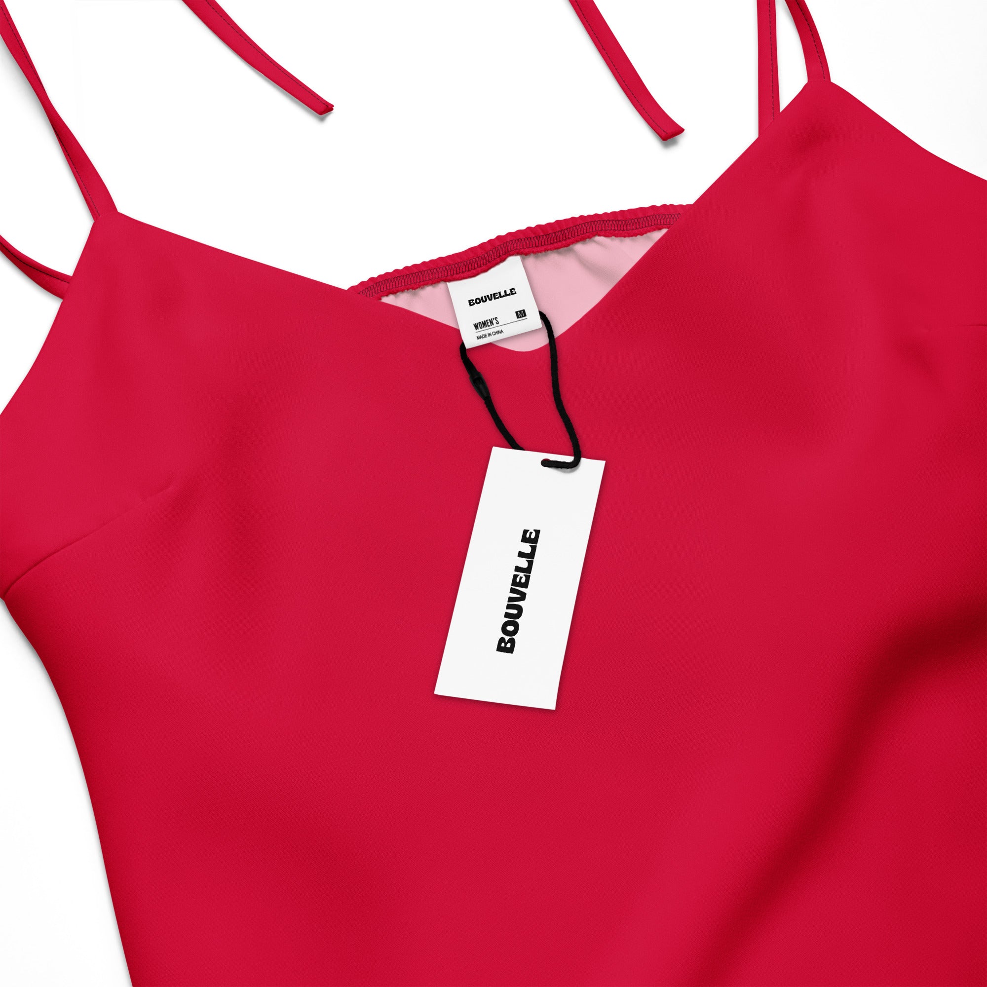 Red dress with a visible brand tag on a white background