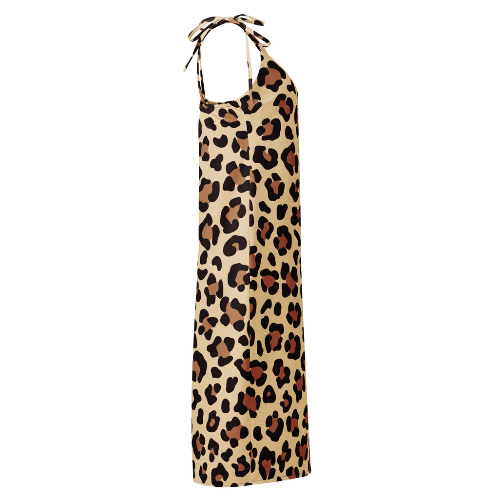 A flowing beige leopard print halter midi dress with adjustable tie straps and a built in bra shown from back