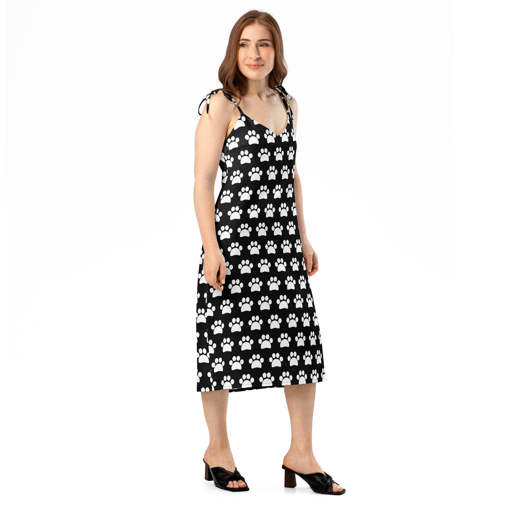Women’s black midi slip dress with white paw print pattern and adjustable tie spaghetti straps with built-in bra
